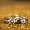 Two diamond rings on a golden surface