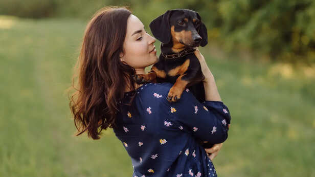 Young girl on a walk with her puppy
