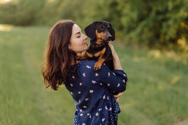 Young girl on a walk with her puppy