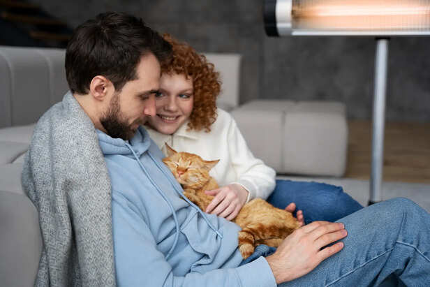Couple holding cat