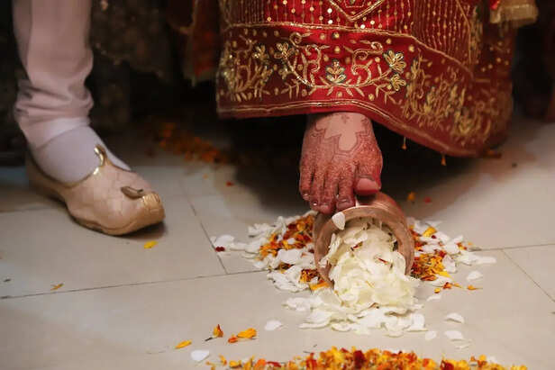 Bride Entering New Home with Rice Kalash