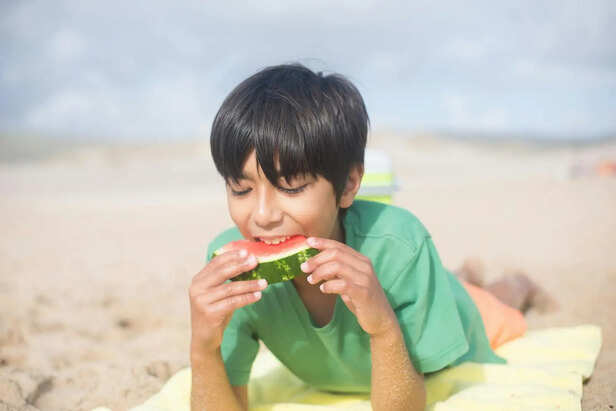 Kid eating watermelon                (Image Credit:Pexels)