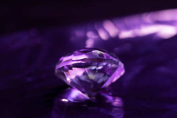 Purple Amethyst Crystal on Bedside Table