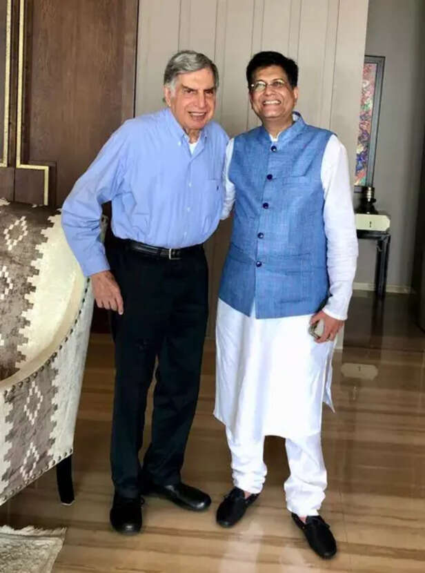 Ratan Tata beside the original Tata Nano