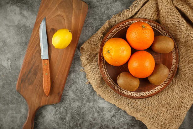 Fresh Orange Peels On Wooden Table