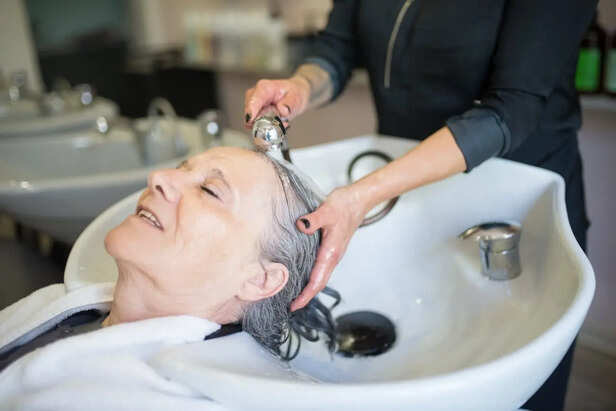 Woman Brushing Wet Hair Aggressively