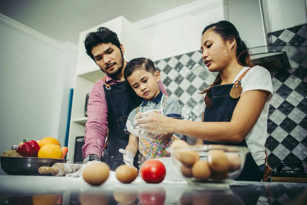 Indian Mother Cooking During Family Gathering