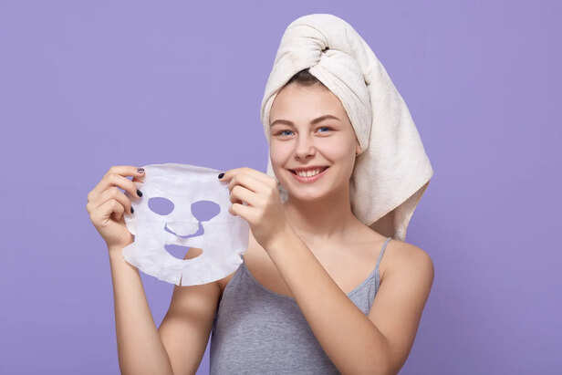 Woman confused between face mask and face pack