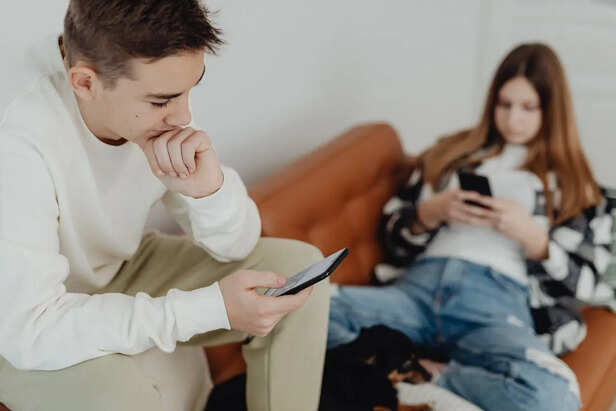 Young Adult Scrolling Through Social Media