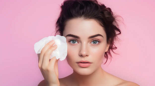 Woman Removing Makeup With Wet Wipe