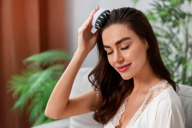 Applying Nourishing Hair Oil At Night