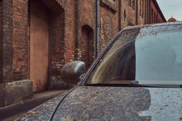 Car Parked Under Harsh Sunlight