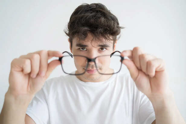 A Person Looking Through Different Lenses
