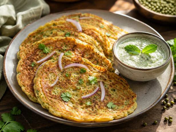 Nutritious Moong Dal Chilla Served With Refreshing Mint Yogurt Dip