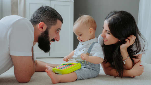 Parents playing with infant