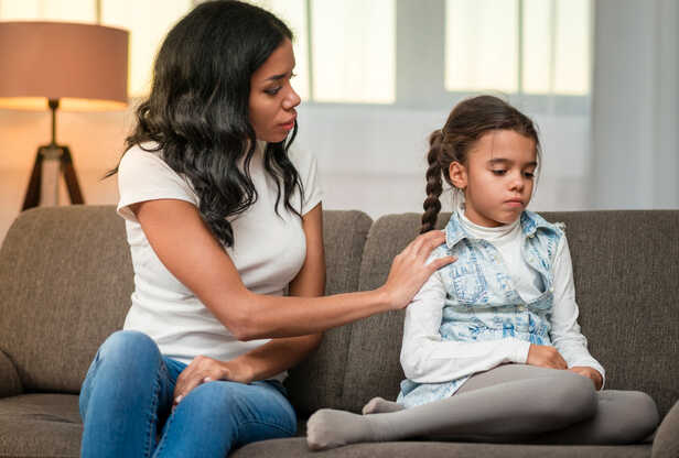 A Child Looking Worried After Being Scolded