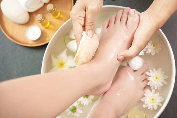 Exfoliating Feet With a Pumice Stone