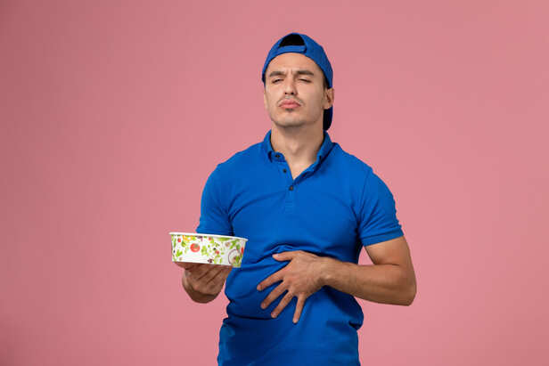 Person holding their stomach after eating