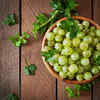 Fresh amla fruits with herbal hair oil
