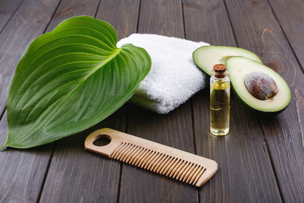 Pure castor oil with wooden comb and hair brush