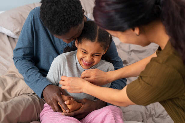 Parents Comforting Their Child