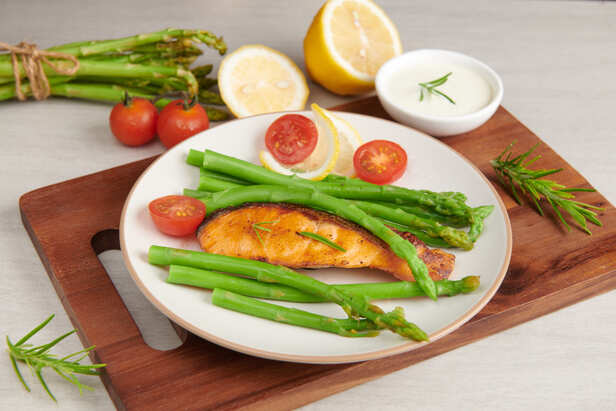 Fresh grilled salmon on a healthy plate