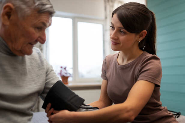 Person Checking Blood Pressure at Home