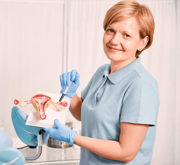 Woman Holding Her Lower Abdomen at Home