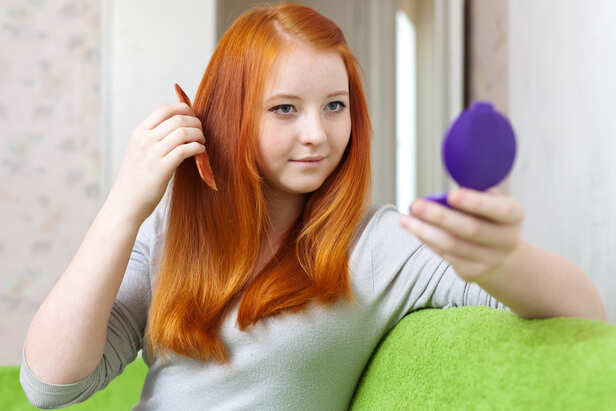 Woman Checking Her Scalp After Hair Colour