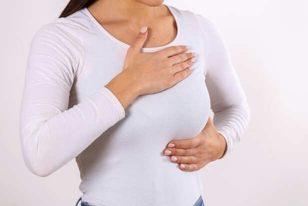 Woman Performing a Breast Self-Check