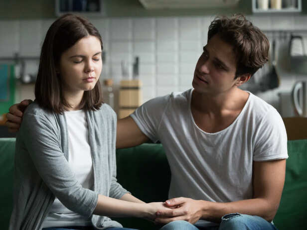 Woman trying to comfort her partner