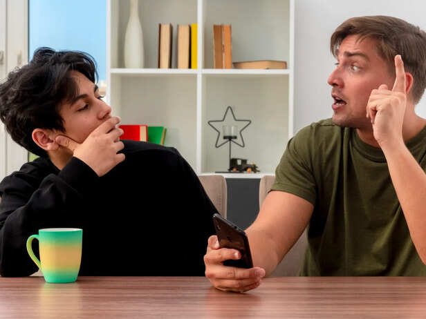 Person Reacting Emotionally During a Conversation