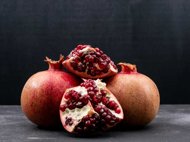 Fresh pomegranate seeds and fruit