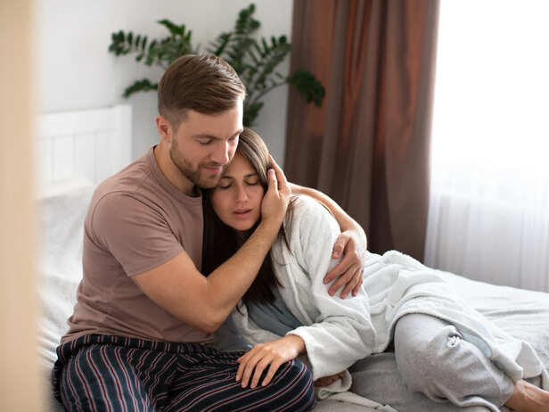 Man comforting his woman