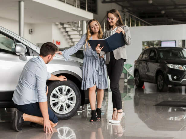 Couple in the car showroom