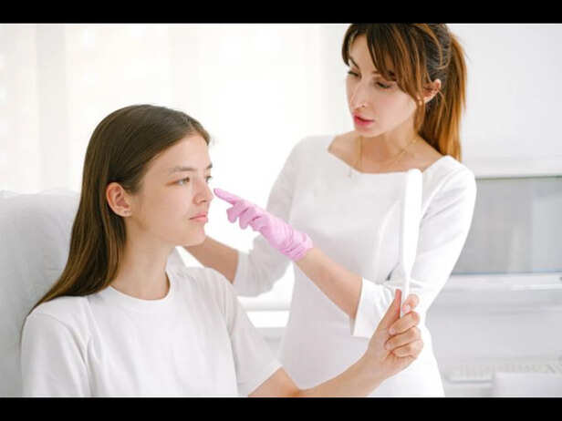 Dermatologist Examining Skin