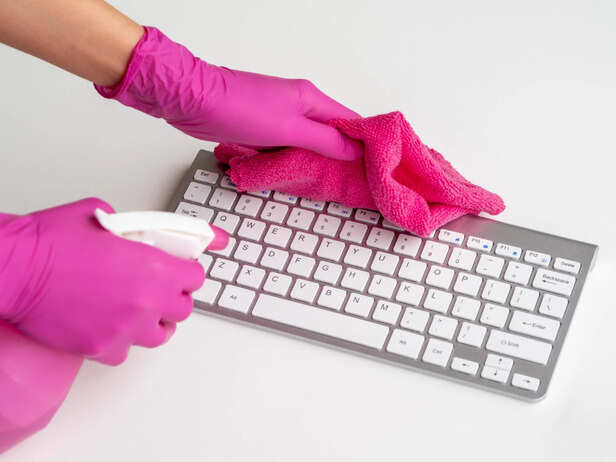 Cleaning Dust Around a Laptop Touchpad