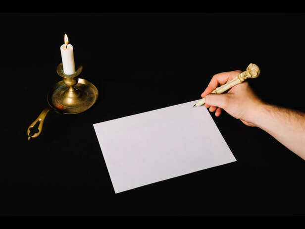 Hands Releasing a Paper Wish