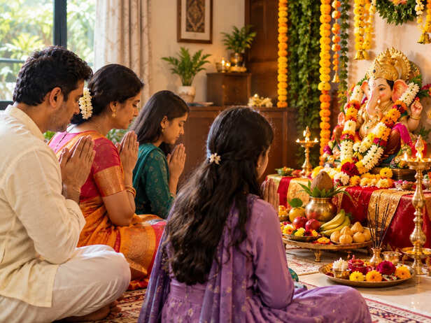 Family praying to Ganesha