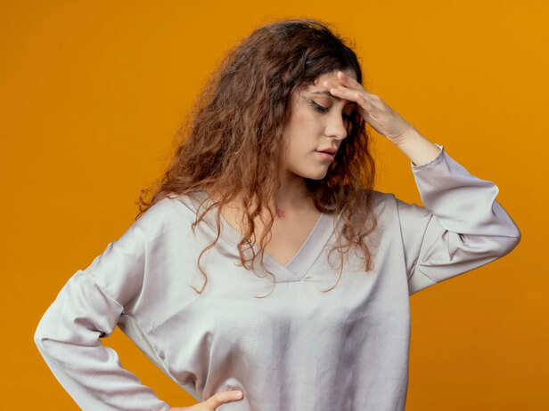 Woman experiencing a migraine during hormonal changes