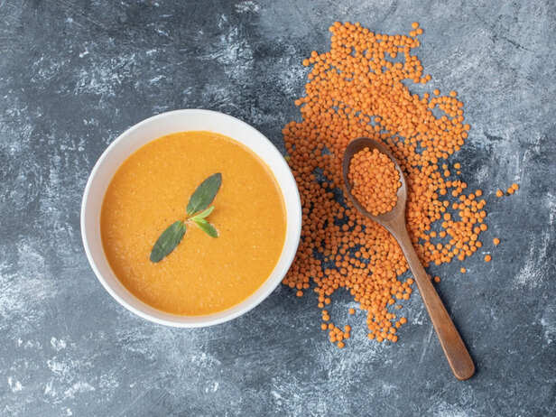 Bowl of dal with vegetables and whole grains
