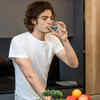 Person drinking water because of dry mouth