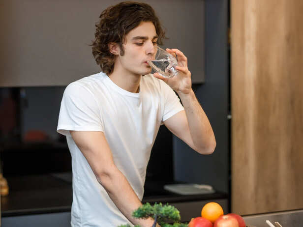 Person drinking water because of dry mouth