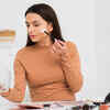 Woman layering multiple skincare products before makeup
