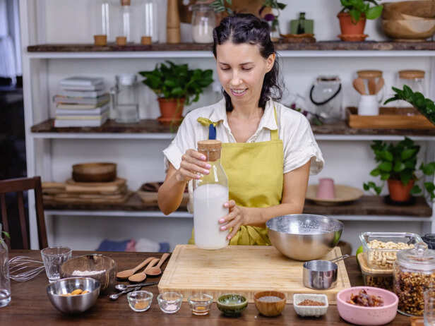 Oats, almonds, seeds, dates and milk arranged for a hair drink