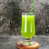 Amla water served with fresh gooseberries