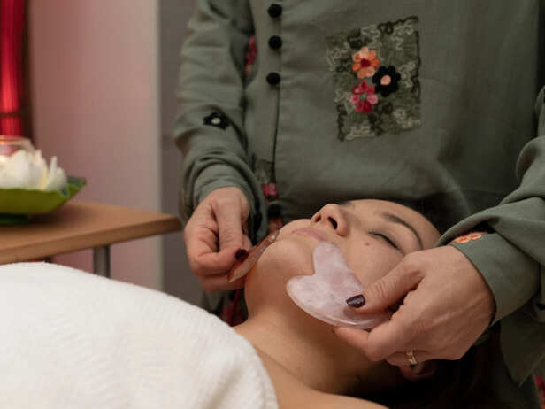 Japanese-inspired facial massage with gentle sweeping motion