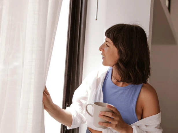 Wife Quietly Looking Out a Window