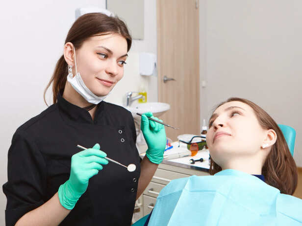Dentist checking oral health