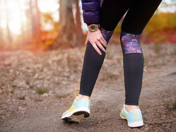 Person Experiencing Leg Pain While Walking